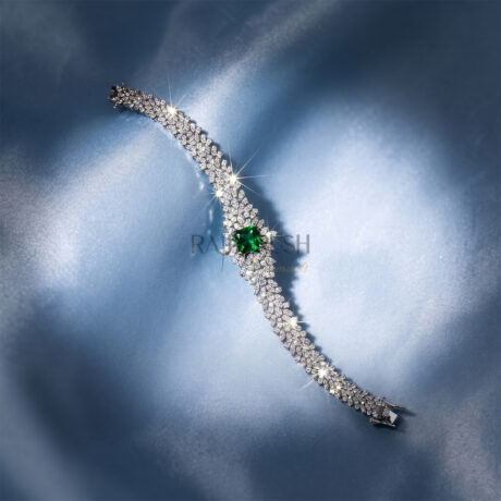 Vibrant Square cut green sapphire and sparkling moissanite statement link bracelet in 925 sterling silver displayed diagonally on a soft blue silk background