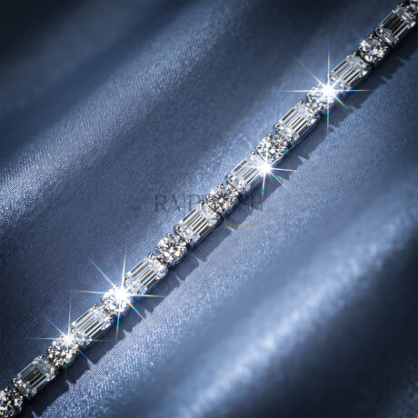 A stunning sterling silver tennis bracelet featuring alternating emerald-cut and round-cut moissanite diamonds