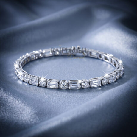 A stunning sterling silver tennis bracelet featuring alternating emerald-cut and round-cut moissanite diamonds
