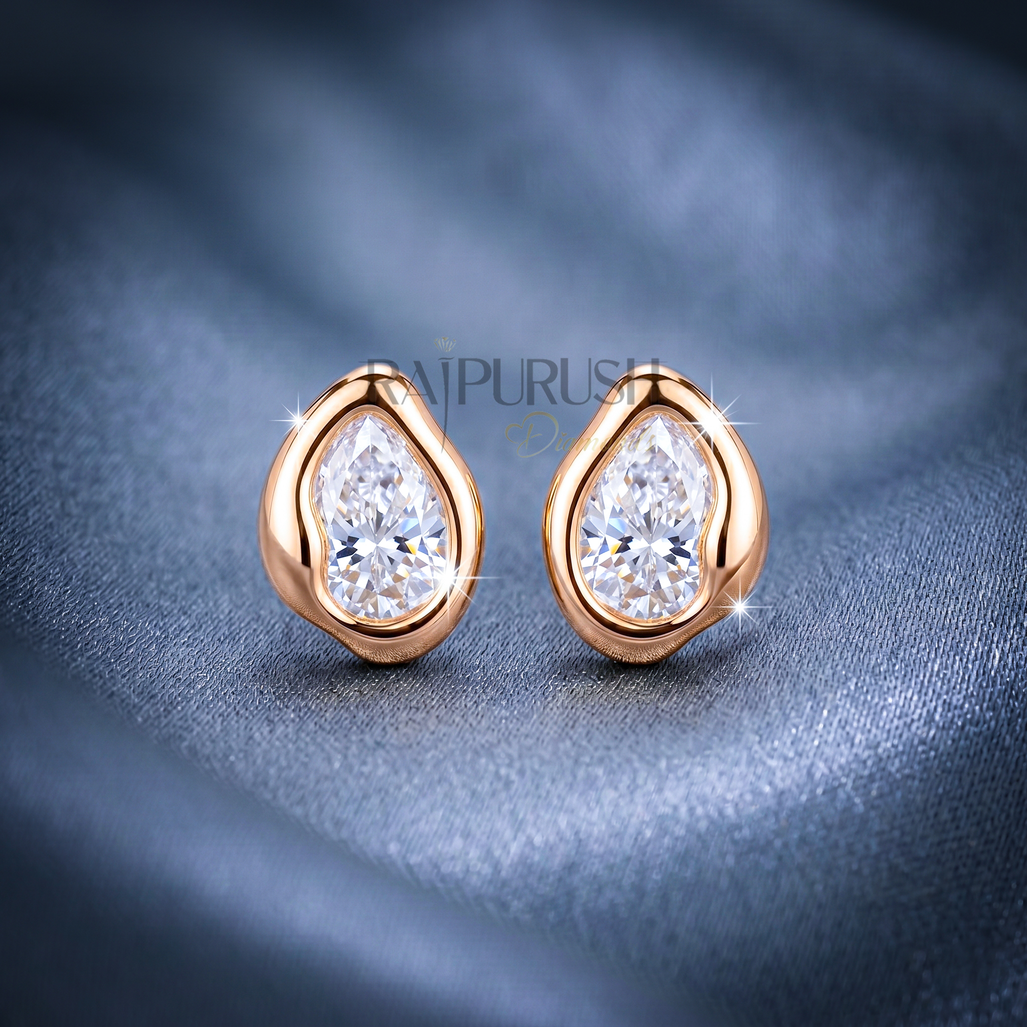 A pair of 2ct each pear-cut moissanite stud earrings in a secure bezel setting, crafted in S925 with polished 14k gold