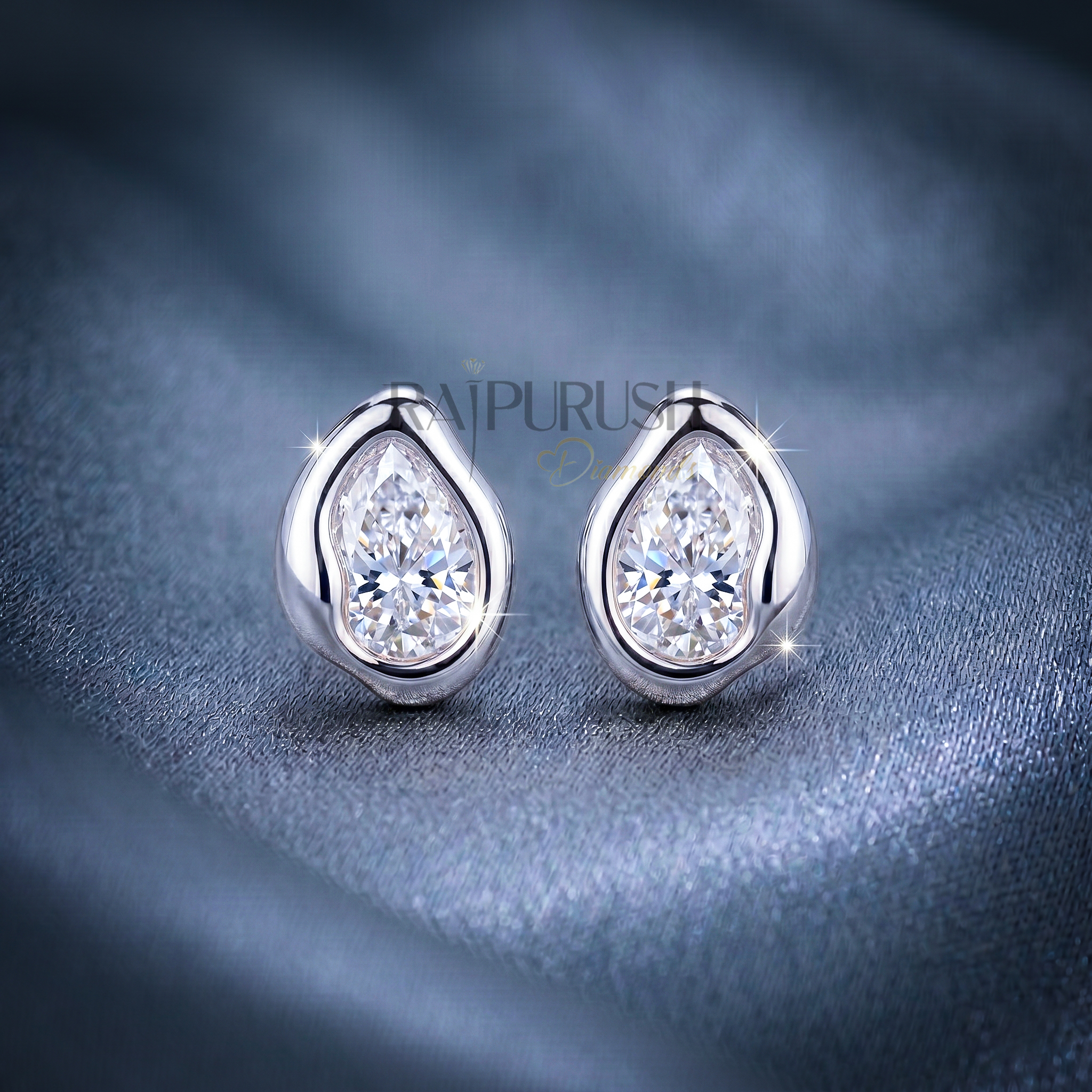 A pair of 2ct each pear-cut moissanite stud earrings in a secure bezel setting, crafted in S925 with polished 14k gold