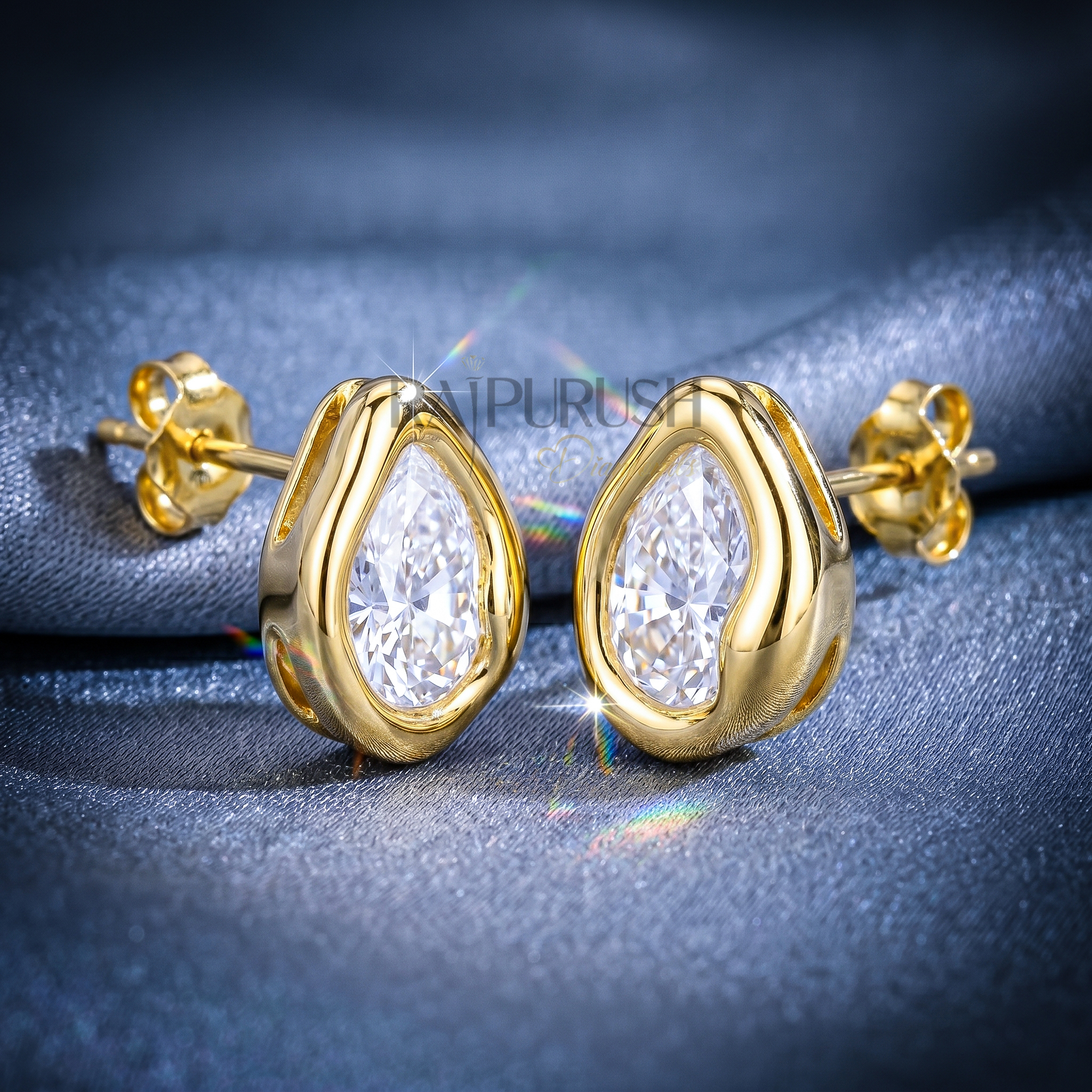 A pair of 2ct each pear-cut moissanite stud earrings in a secure bezel setting, crafted in S925 with polished 14k gold
