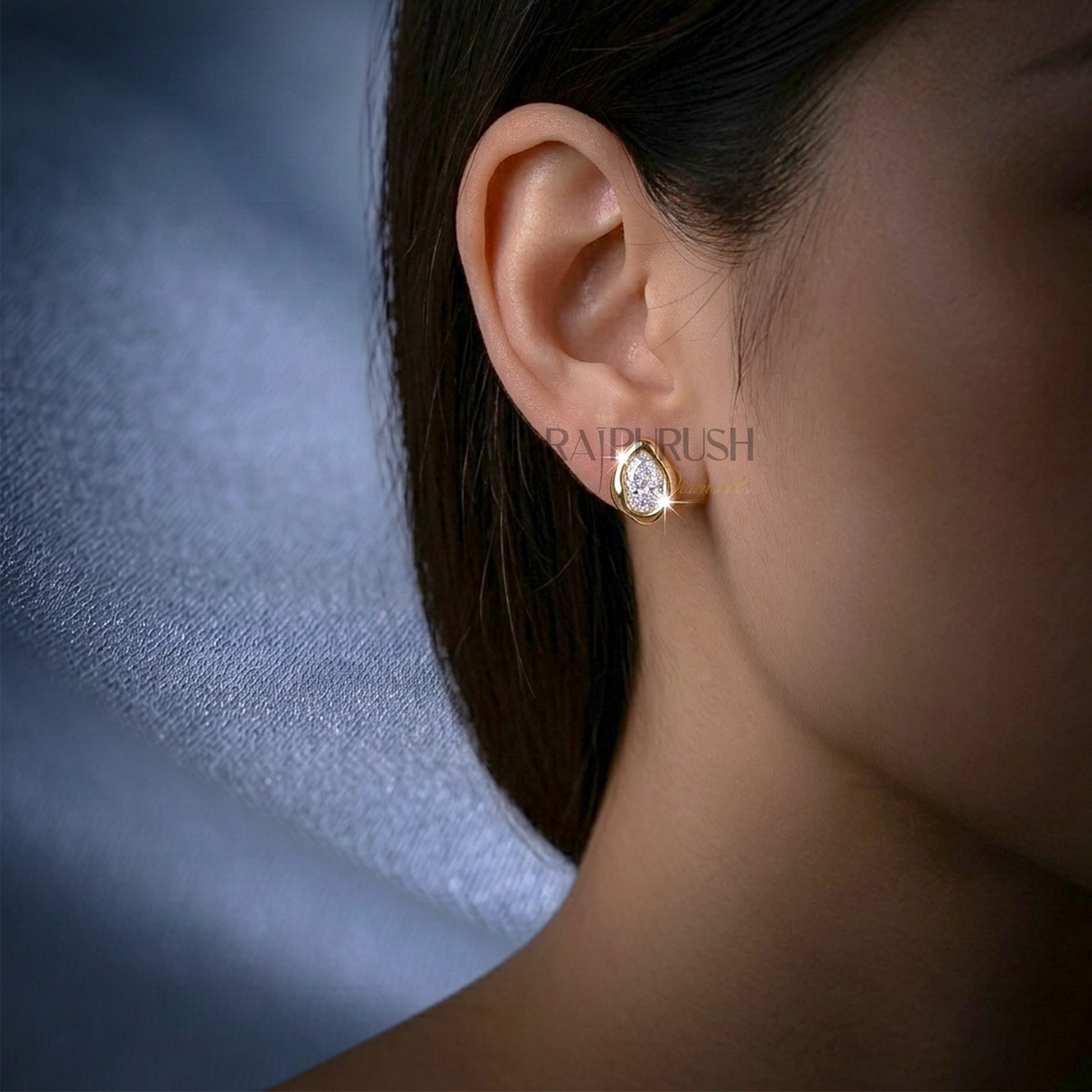 A pair of 2ct each pear-cut moissanite stud earrings in a secure bezel setting, crafted in S925 with polished 14k gold