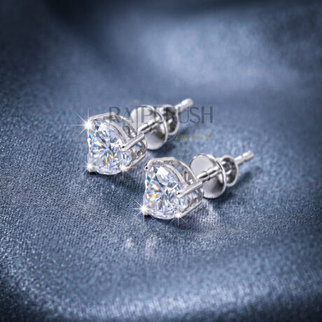 brilliant heart-shaped moissanite stud earrings in 14k yellow gold plated sterling silver, showcasing their fire and sparkle.