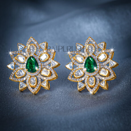 Luxury floral stud earrings featuring a central pear-cut emerald surrounded by Polki and round brilliant diamonds in 18K gold