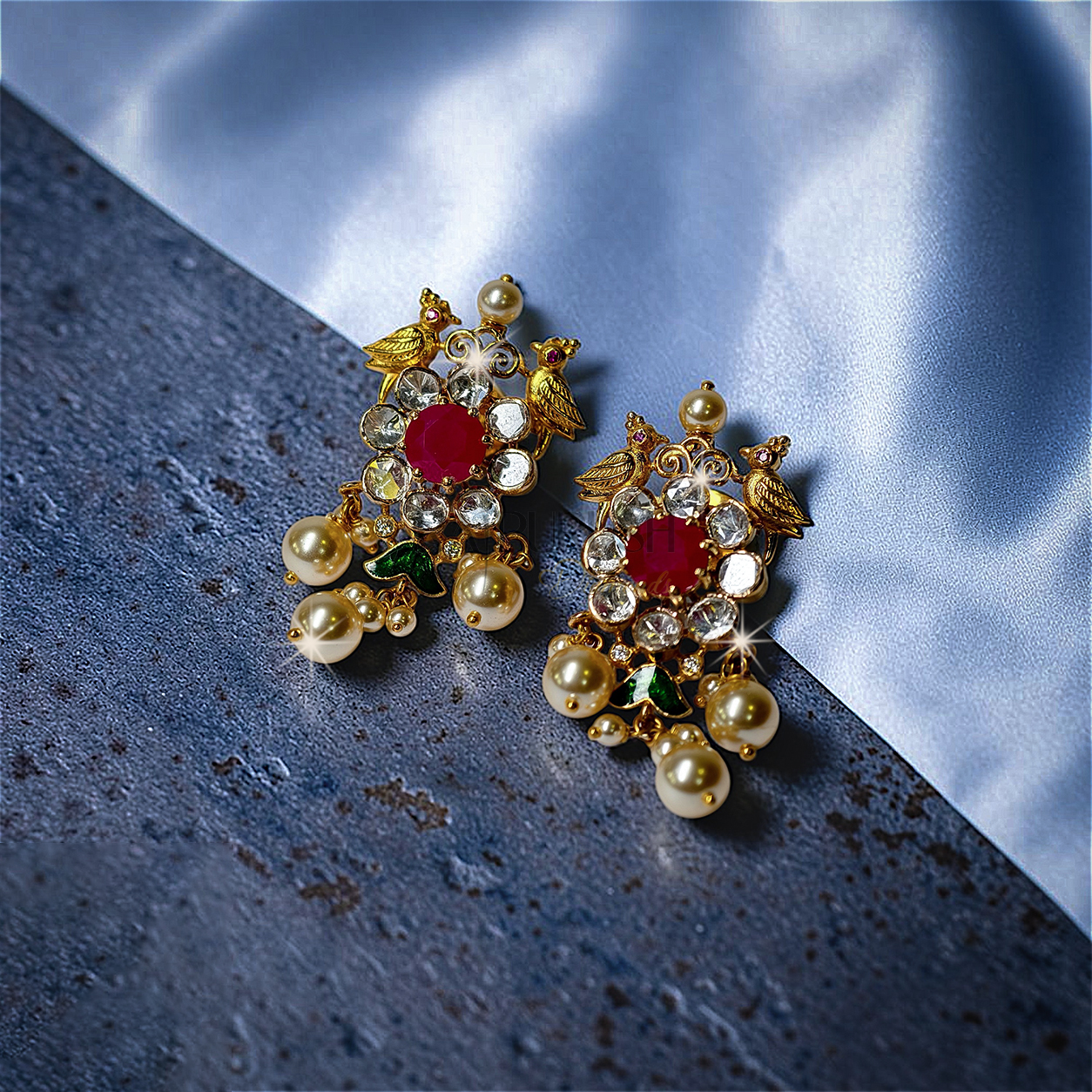 Traditional Indian heritage jewelry set featuring bird motifs with vibrant rubies and uncut Polki(uncut diamond)diamonds set in 18k yellow gold.