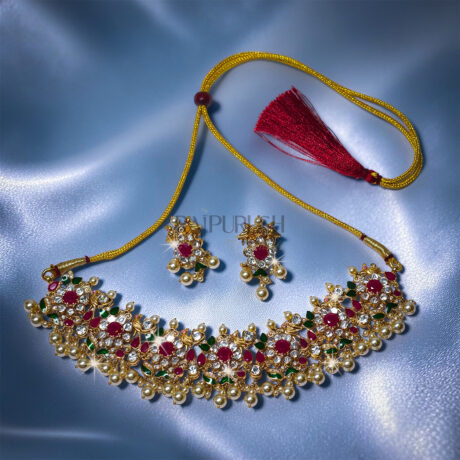 Traditional Indian heritage jewelry set featuring bird motifs with vibrant rubies and uncut Polki(uncut diamond)diamonds set in 18k yellow gold.
