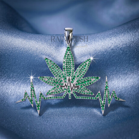 a heartbeat-shaped pendant featuring a green emerald leaf motif, crafted in 925 sterling silver with sparkling round diamond accents.