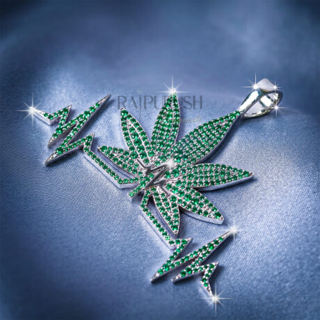 a heartbeat-shaped pendant featuring a green emerald leaf motif, crafted in 925 sterling silver with sparkling round diamond accents.