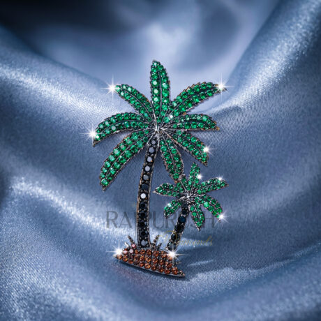 Luxury iced out palm tree pendant featuring vibrant green stones and rhodium-plated silver