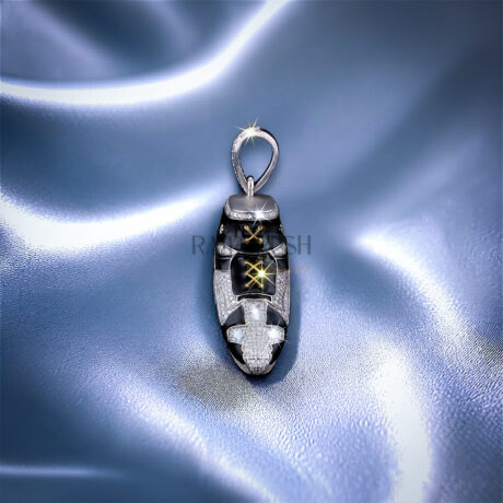 iced out moissanite sneaker pendant with black enamel detailing and gold laces on a blue silk background.