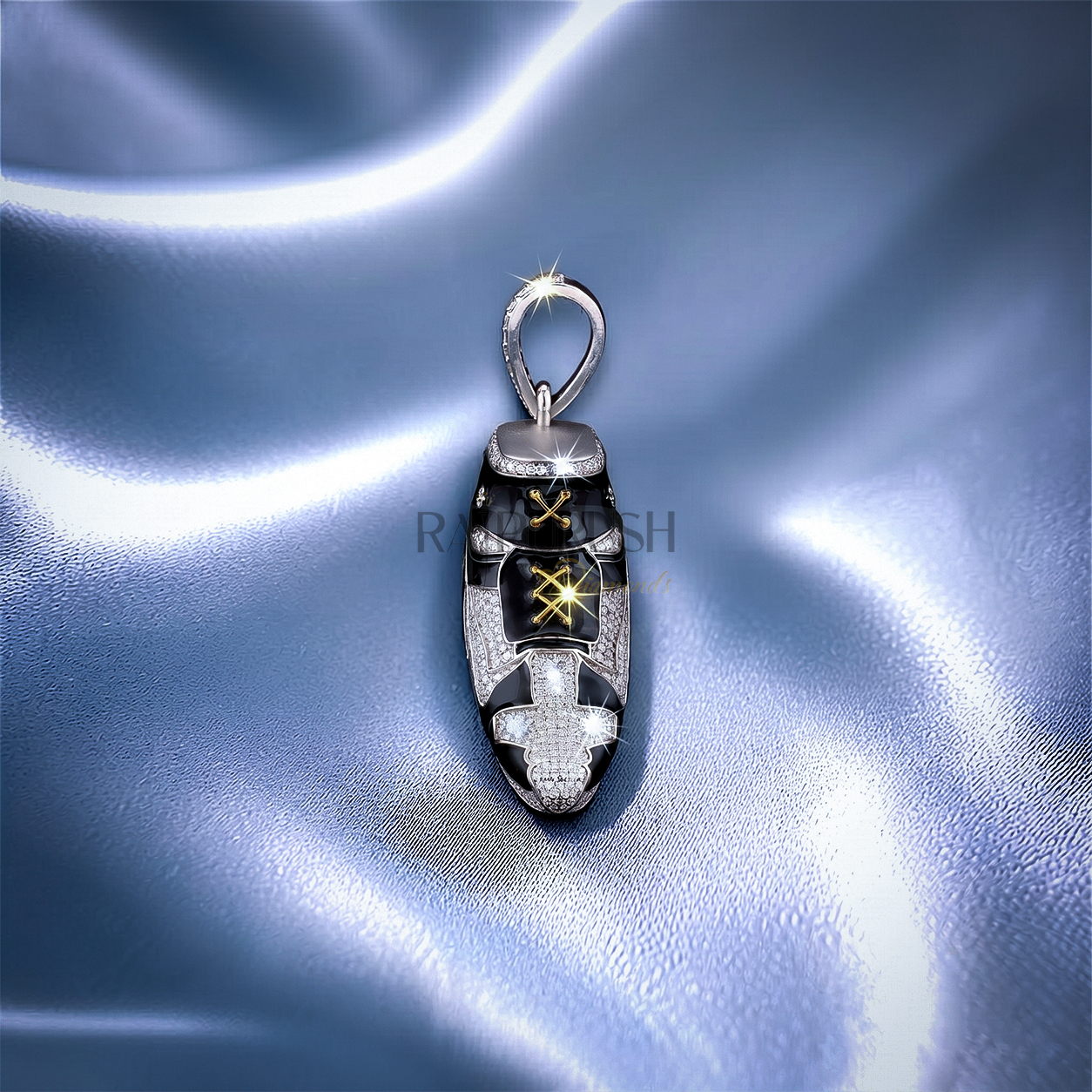 iced out moissanite sneaker pendant with black enamel detailing and gold laces on a blue silk background.