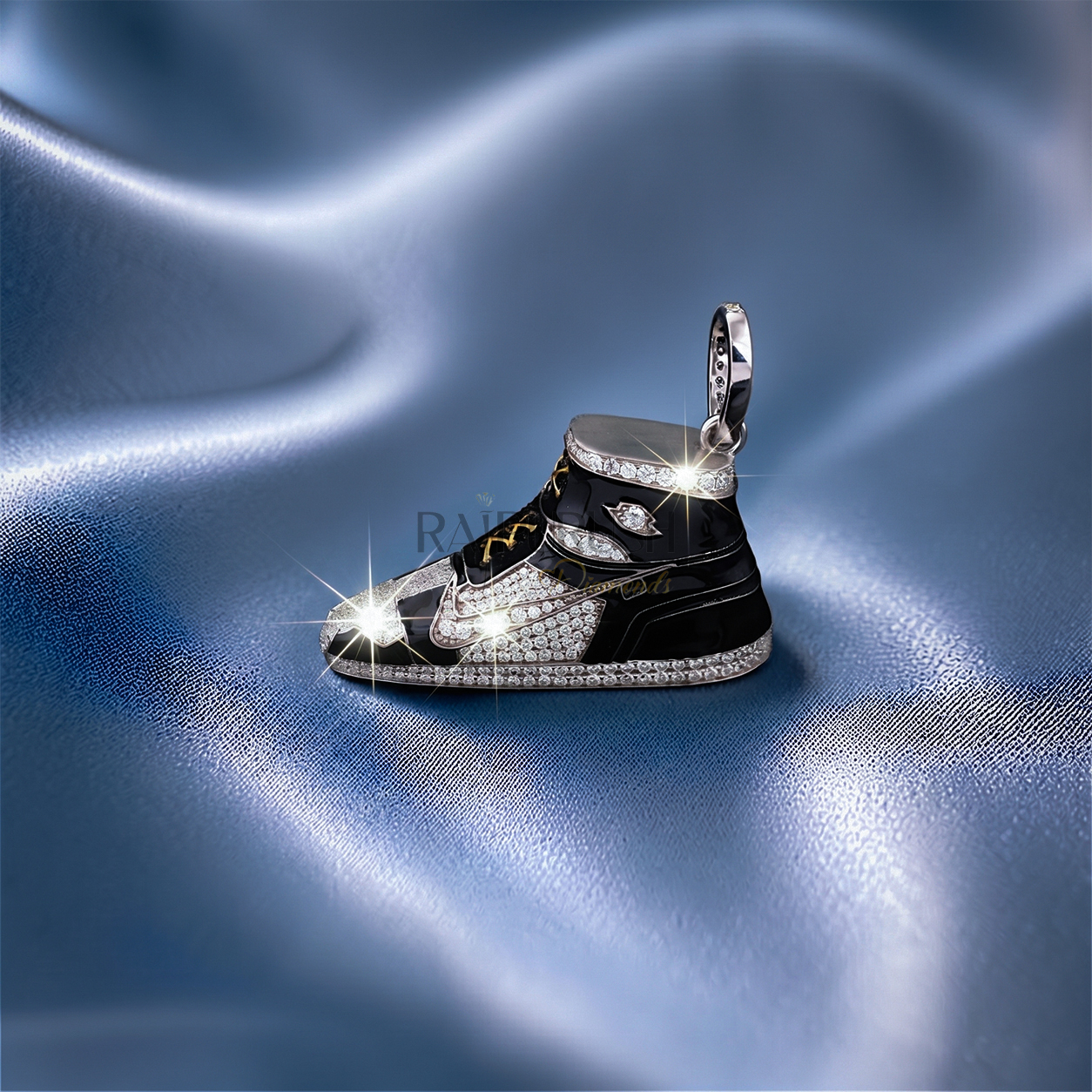 iced out moissanite sneaker pendant with black enamel detailing and gold laces on a blue silk background.
