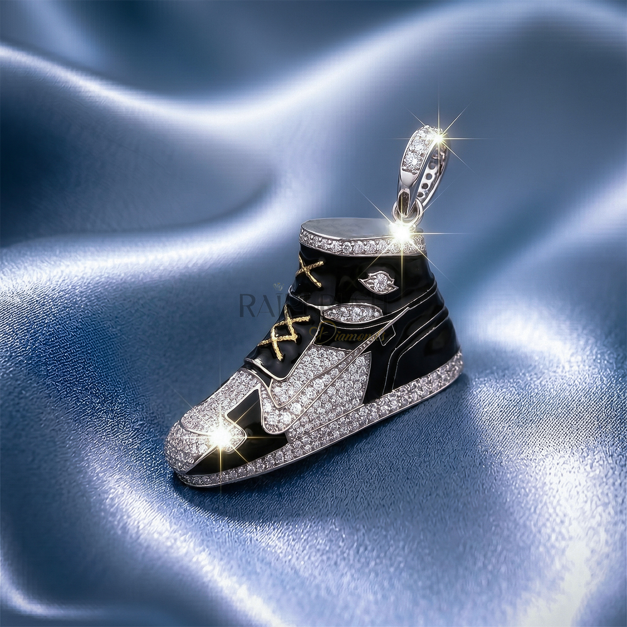 iced out moissanite sneaker pendant with black enamel detailing and gold laces on a blue silk background.