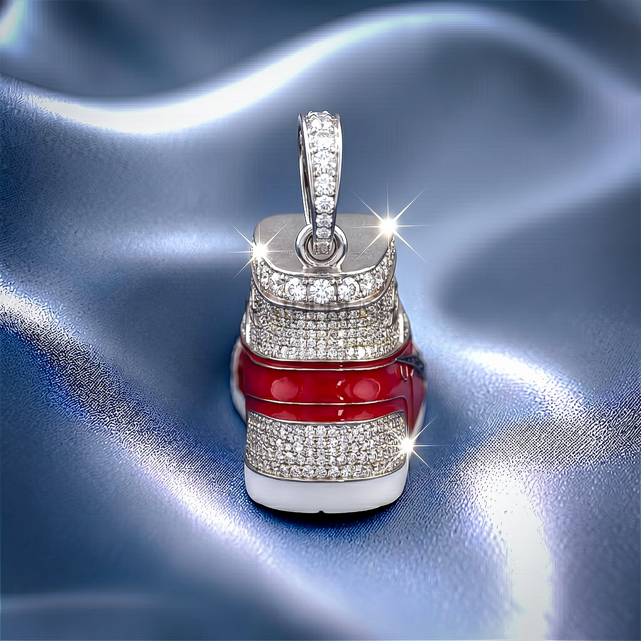 Detailed dynamic angle of a silver hip hop sneaker pendant completely flooded with round brilliant moissanite stones and vibrant red enamel accents.