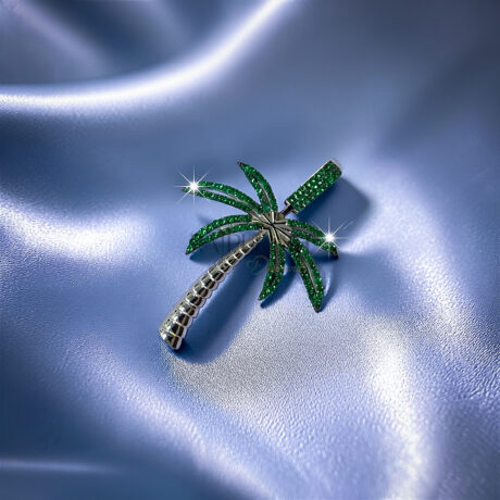 hip hop palm tree pendant fully iced out with white moissanite on the trunk and vibrant green moissanite stones on the leaves in 925 sterling silver.