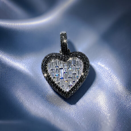Bold iced-out heart pendant in 925 sterling silver featuring a center of seamless mosaic baguette diamonds bordered by a frame of black round moissanite stones.