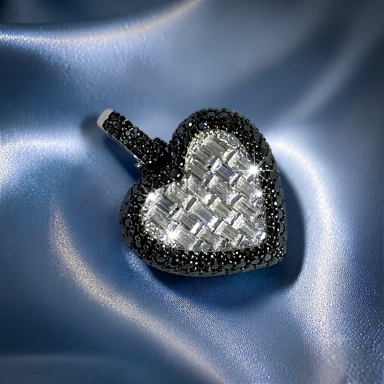 Bold iced-out heart pendant in 925 sterling silver featuring a center of seamless mosaic baguette diamonds bordered by a frame of black round moissanite stones.
