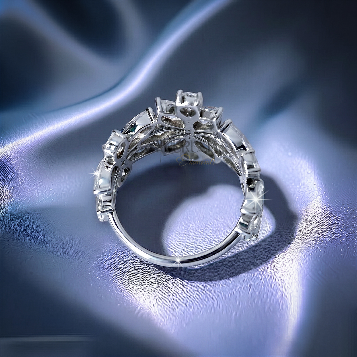 Unique multi-shape cluster wedding band in 925 sterling silver showcasing an asymmetric scattered layout of round, pear, and marquise-cut moissanite diamonds.