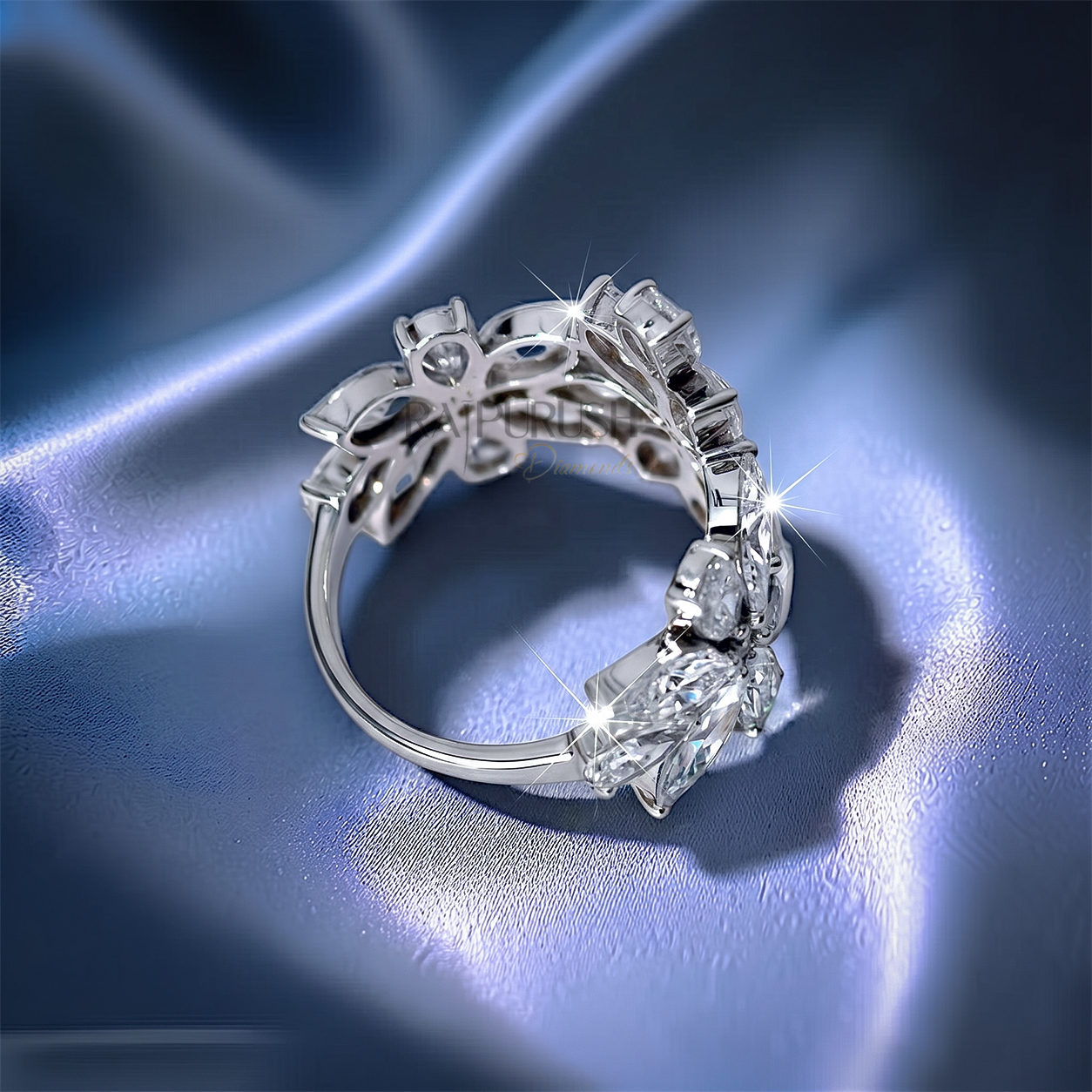 Unique multi-shape cluster wedding band in 925 sterling silver showcasing an asymmetric scattered layout of round, pear, and marquise-cut moissanite diamonds.