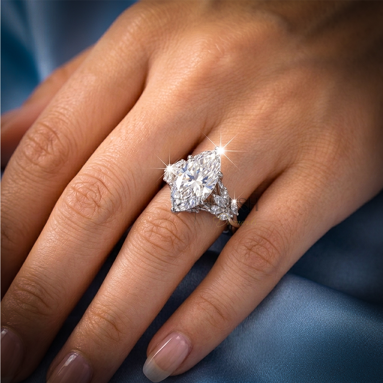 Modern 925 sterling silver engagement ring featuring a horizontally set marquise cut moissanite diamond solitaire on an ultra-dainty high-polish band.