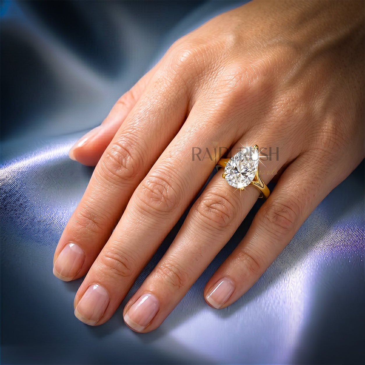 1 carat pear cut solitaire engagement ring in 14k yellow gold plated sterling silver, Side profile of a 1ct teardrop diamond simulant wedding ring showcasing a split shank cathedral setting. Under-gallery view of a gold plated pear cut solitaire ring showing the elegant open basket framework.