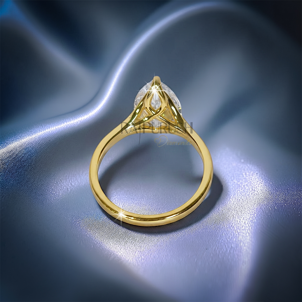 1 carat pear cut solitaire engagement ring in 14k yellow gold plated sterling silver, Side profile of a 1ct teardrop diamond simulant wedding ring showcasing a split shank cathedral setting. Under-gallery view of a gold plated pear cut solitaire ring showing the elegant open basket framework.