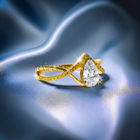 Elegant pear-cut moissanite engagement ring with a gold-plated criss-cross split shank band.