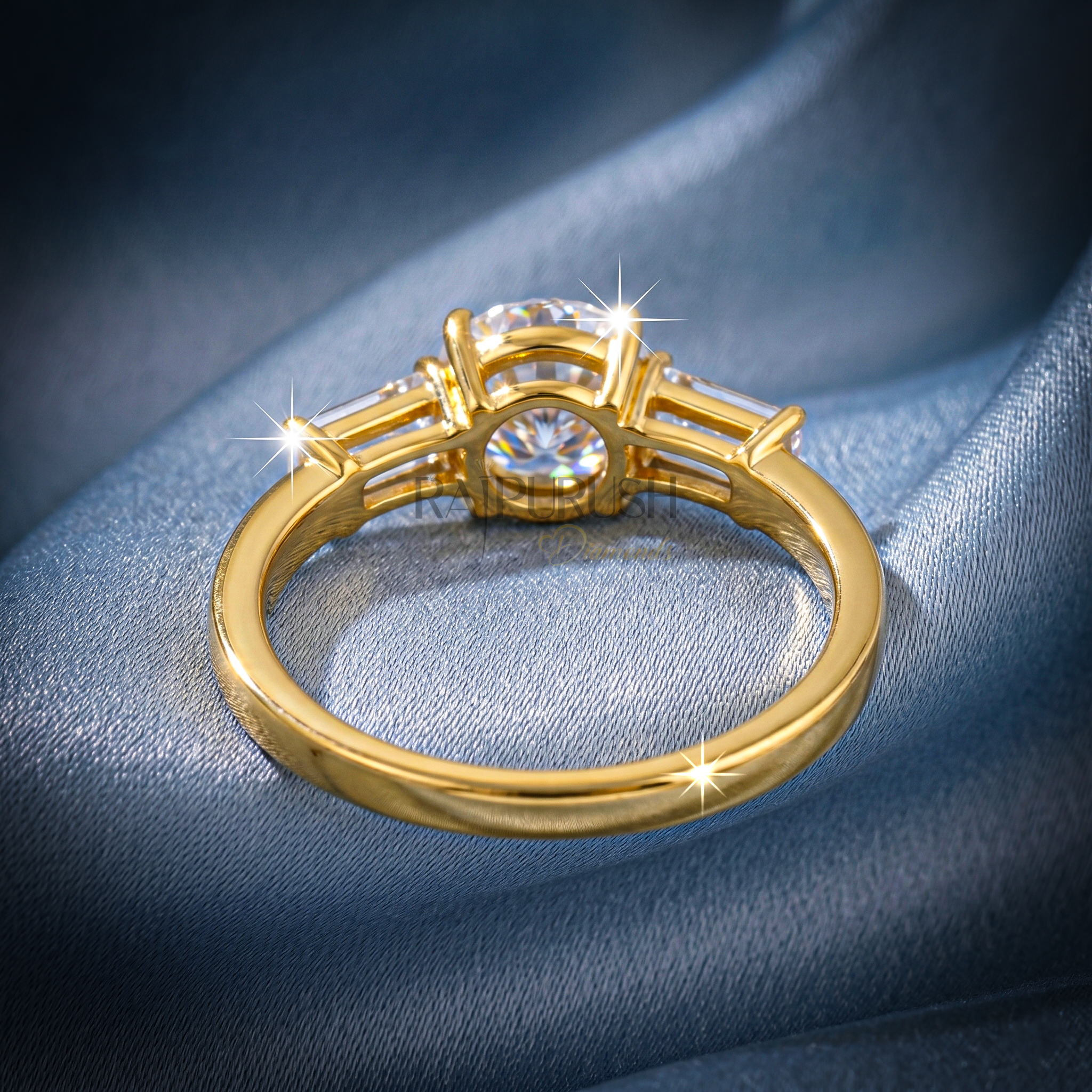Elegant three-stone engagement ring featuring a round brilliant moissanite center with baguette side stones in 14k gold-plated silver.