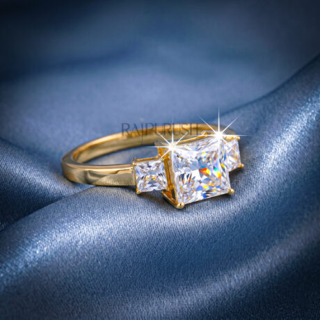 1.50 Carat princess cut moissanite engagement ring with two side stones in a classic three-stone setting, finished in 14k yellow/rose gold plating.