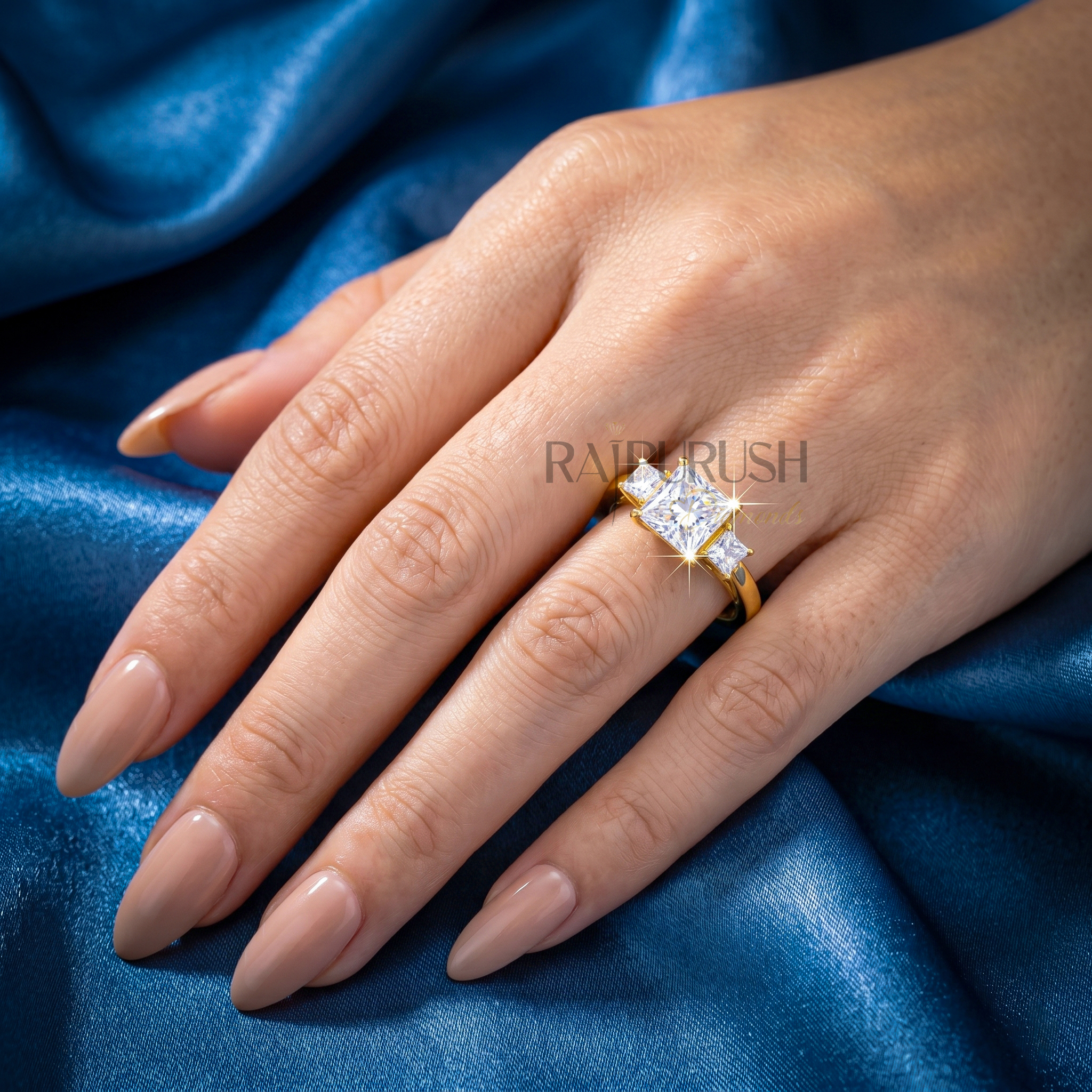 1.50 Carat princess cut moissanite engagement ring with two side stones in a classic three-stone setting, finished in 14k yellow/rose gold plating.