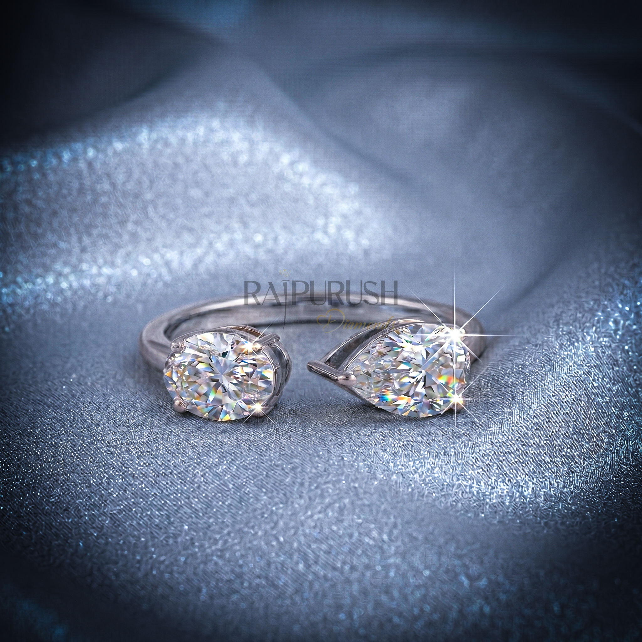 A modern "Toi et Moi" style engagement ring featuring pear and oval cut moissanite stones, finished in 14k yellow/rose gold plating.