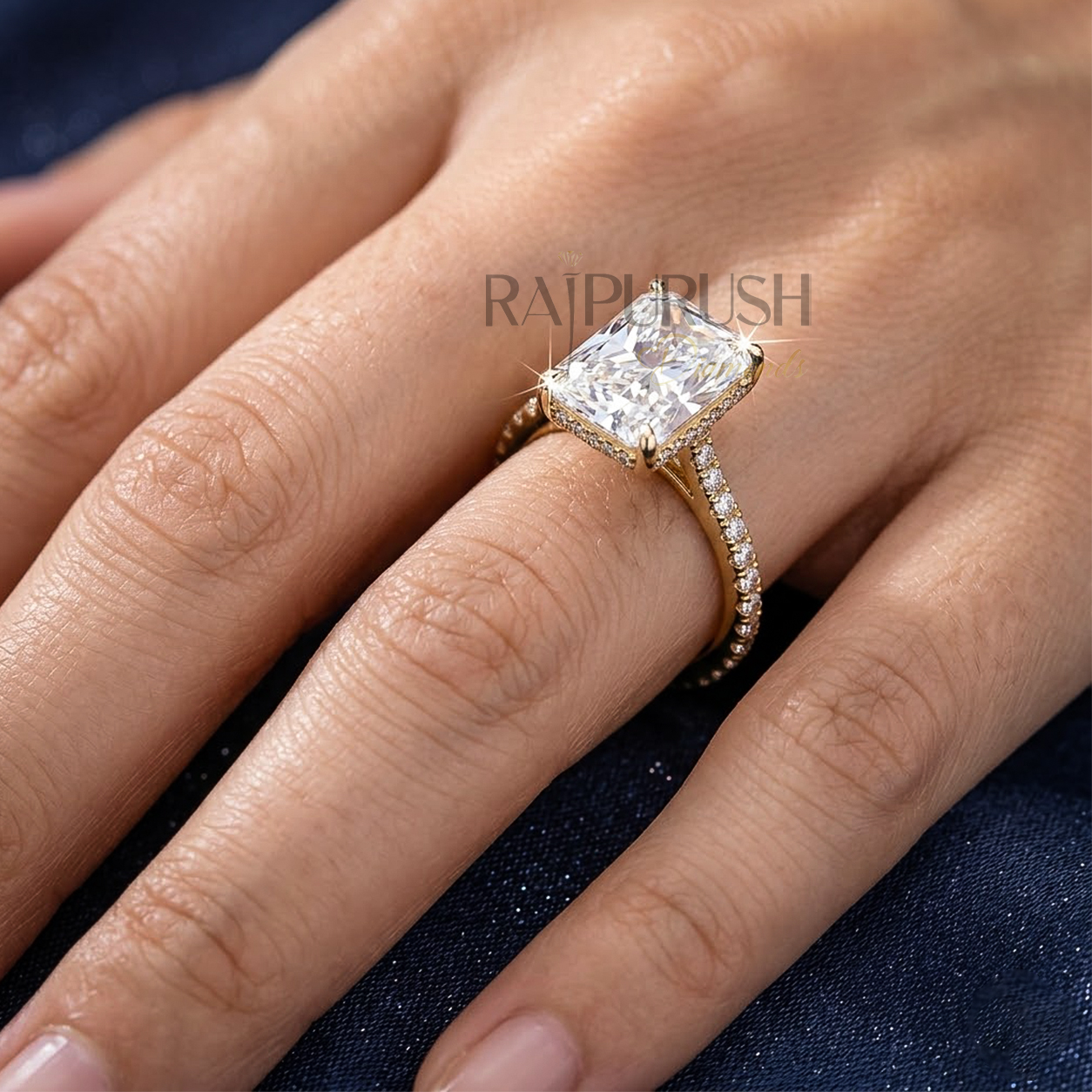 "1.5ct radiant cut moissanite engagement ring with hidden halo and side stones in 14k gold finish".