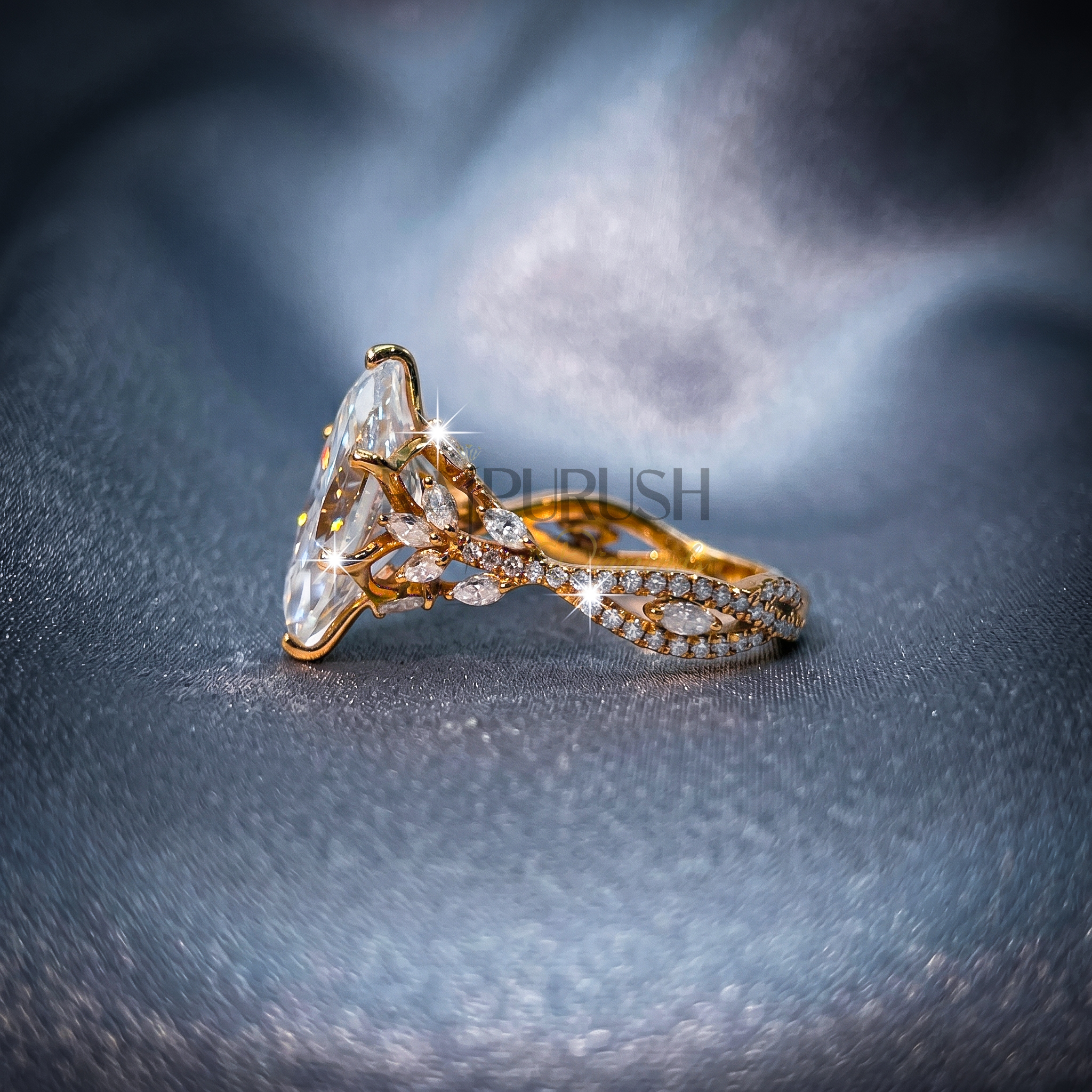 A stunning 3ct marquise-cut moissanite engagement ring featuring intricate side details in polished 14k yellow gold