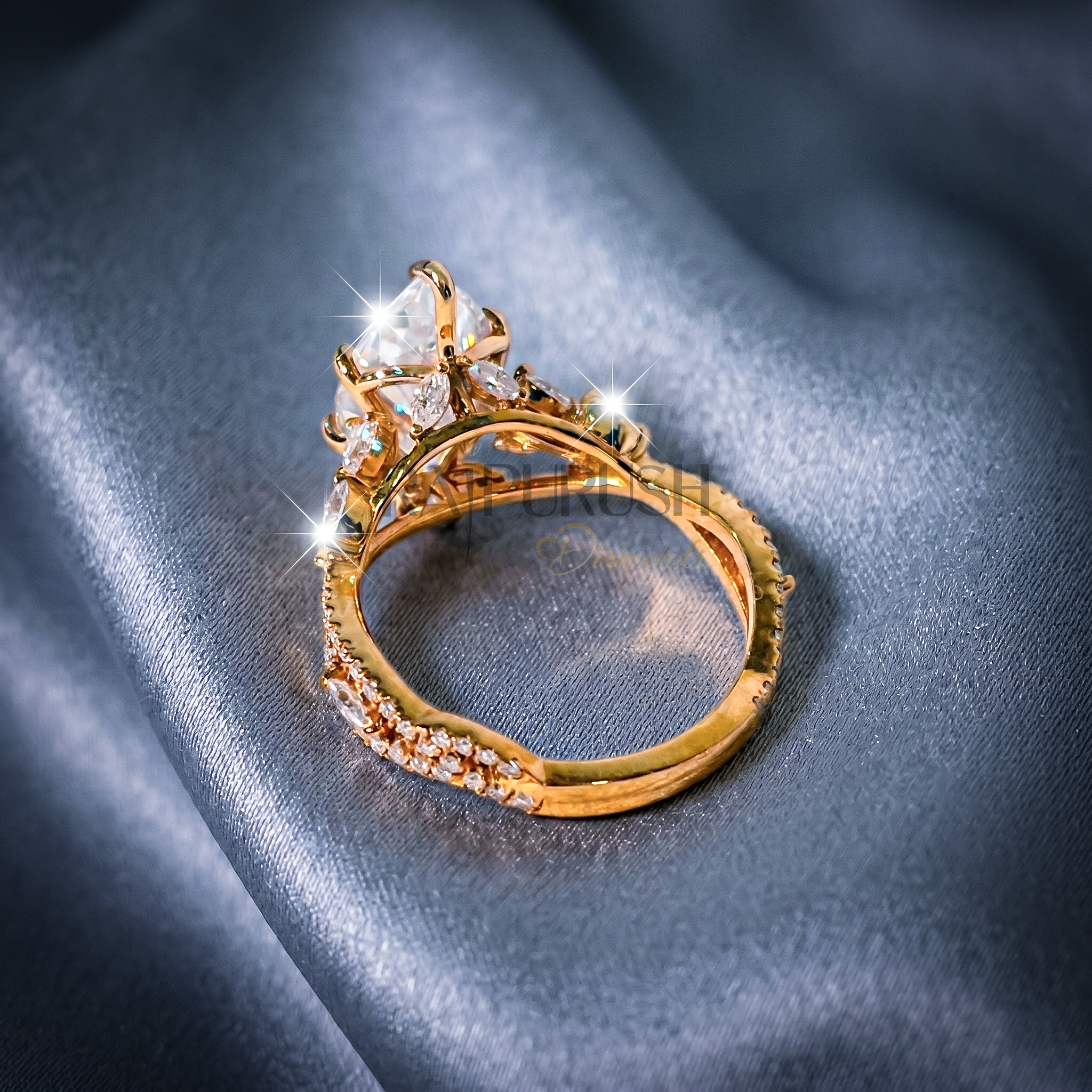 A stunning 3ct marquise-cut moissanite engagement ring featuring intricate side details in polished 14k yellow gold