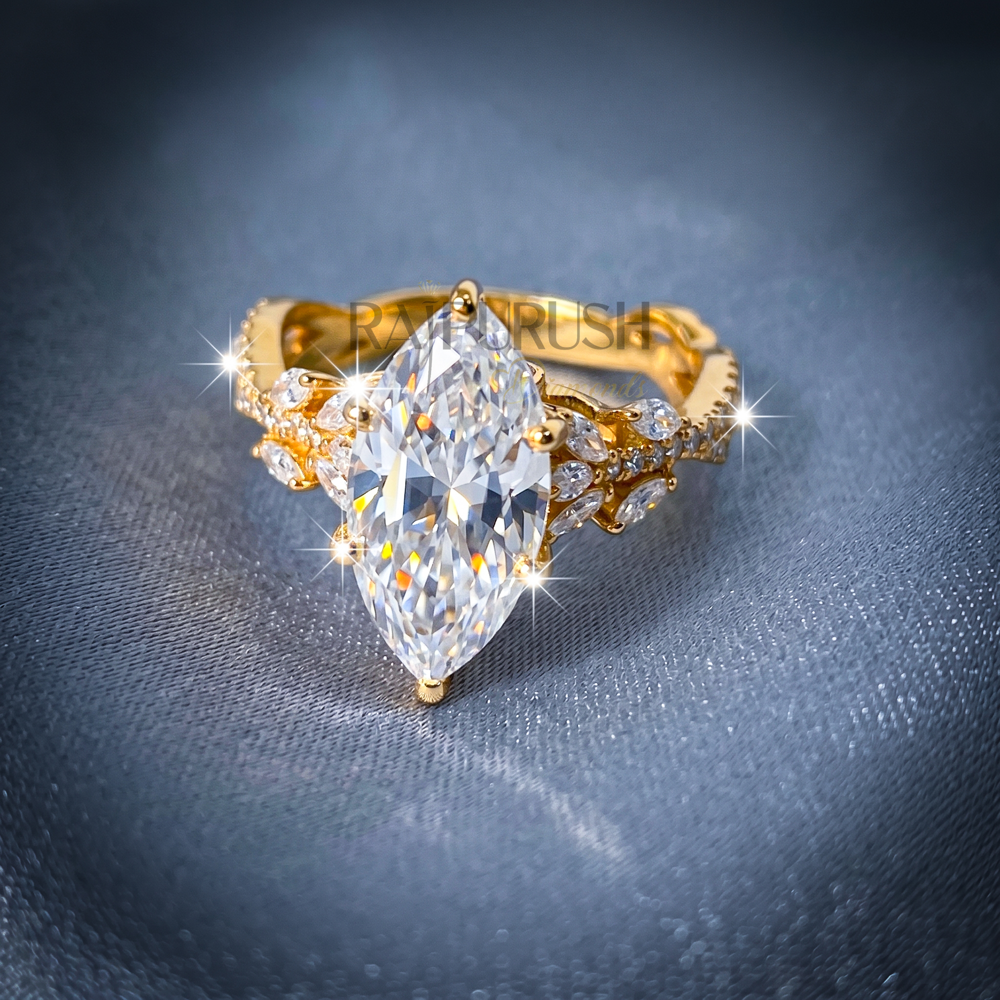 A stunning 3ct marquise-cut moissanite engagement ring featuring intricate side details in polished 14k yellow gold