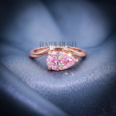 A stunning 1ct pear-cut moissanite solitaire engagement ring set in polished 14k gold