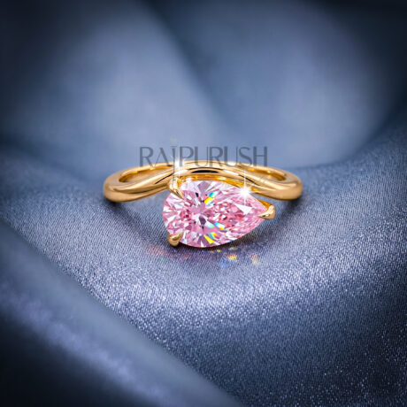A stunning 1ct pear-cut moissanite solitaire engagement ring set in polished 14k gold