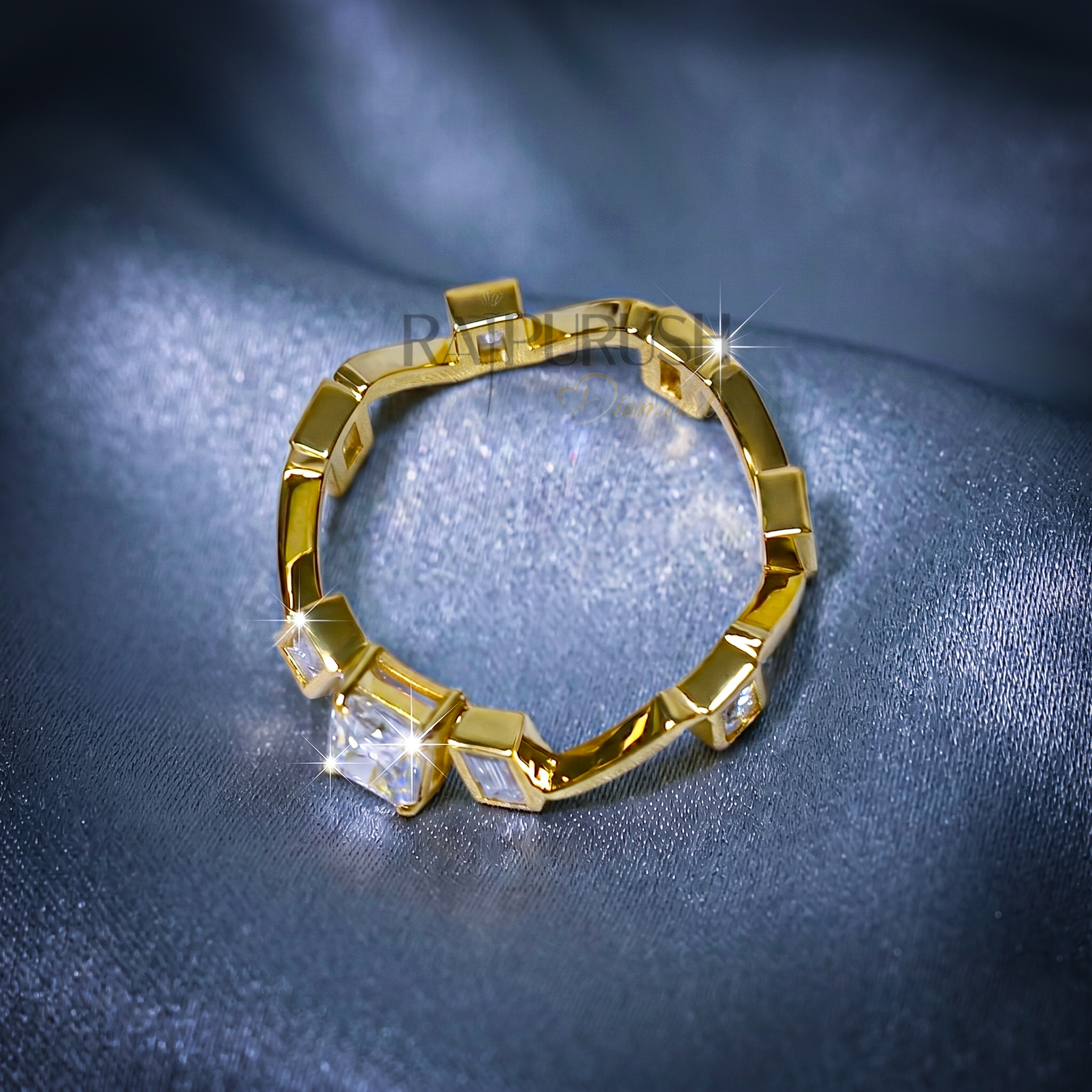 Close-up of a radiant cut and baguette moissanite engagement ring in 14k yellow gold plated sterling silver