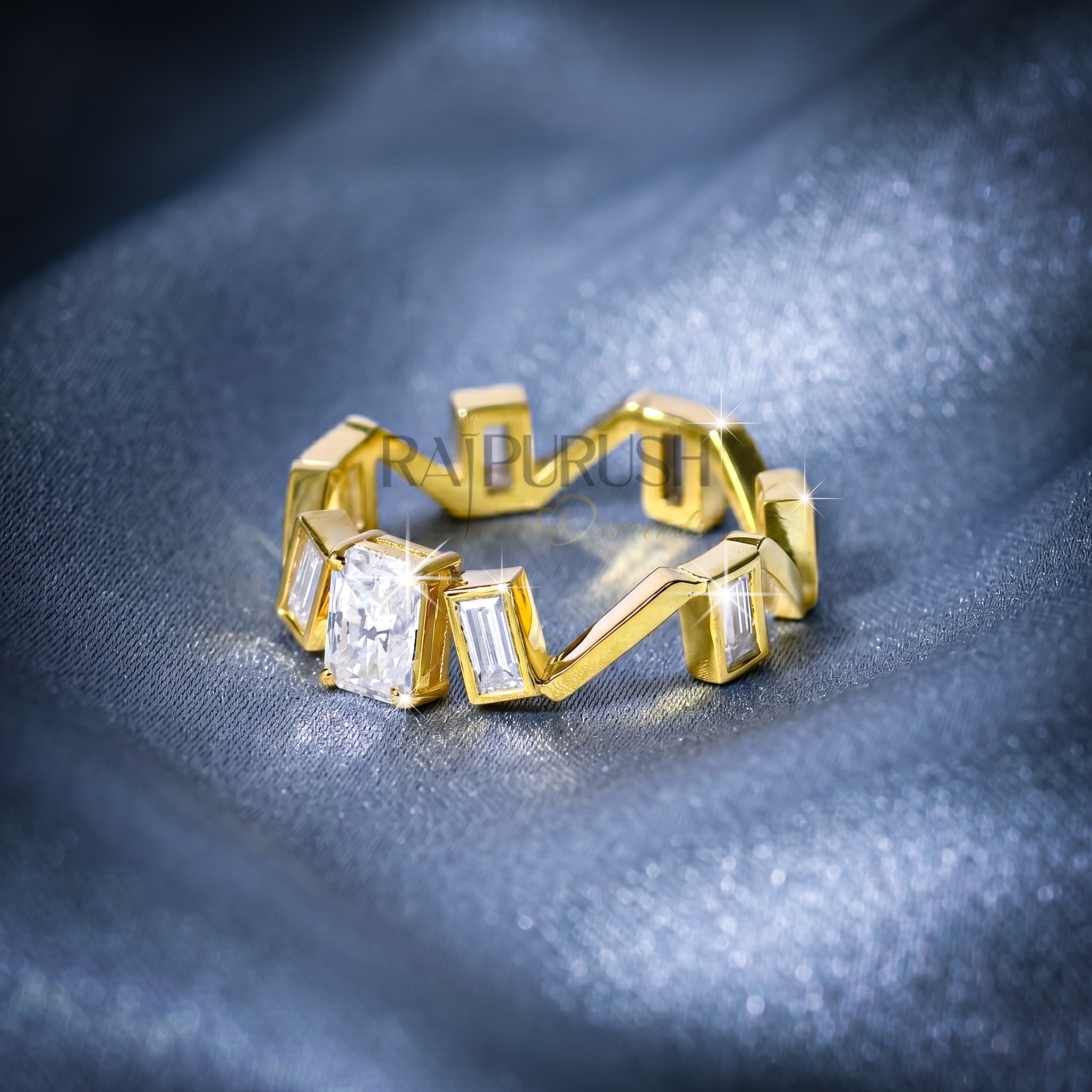 Close-up of a radiant cut and baguette moissanite engagement ring in 14k yellow gold plated sterling silver