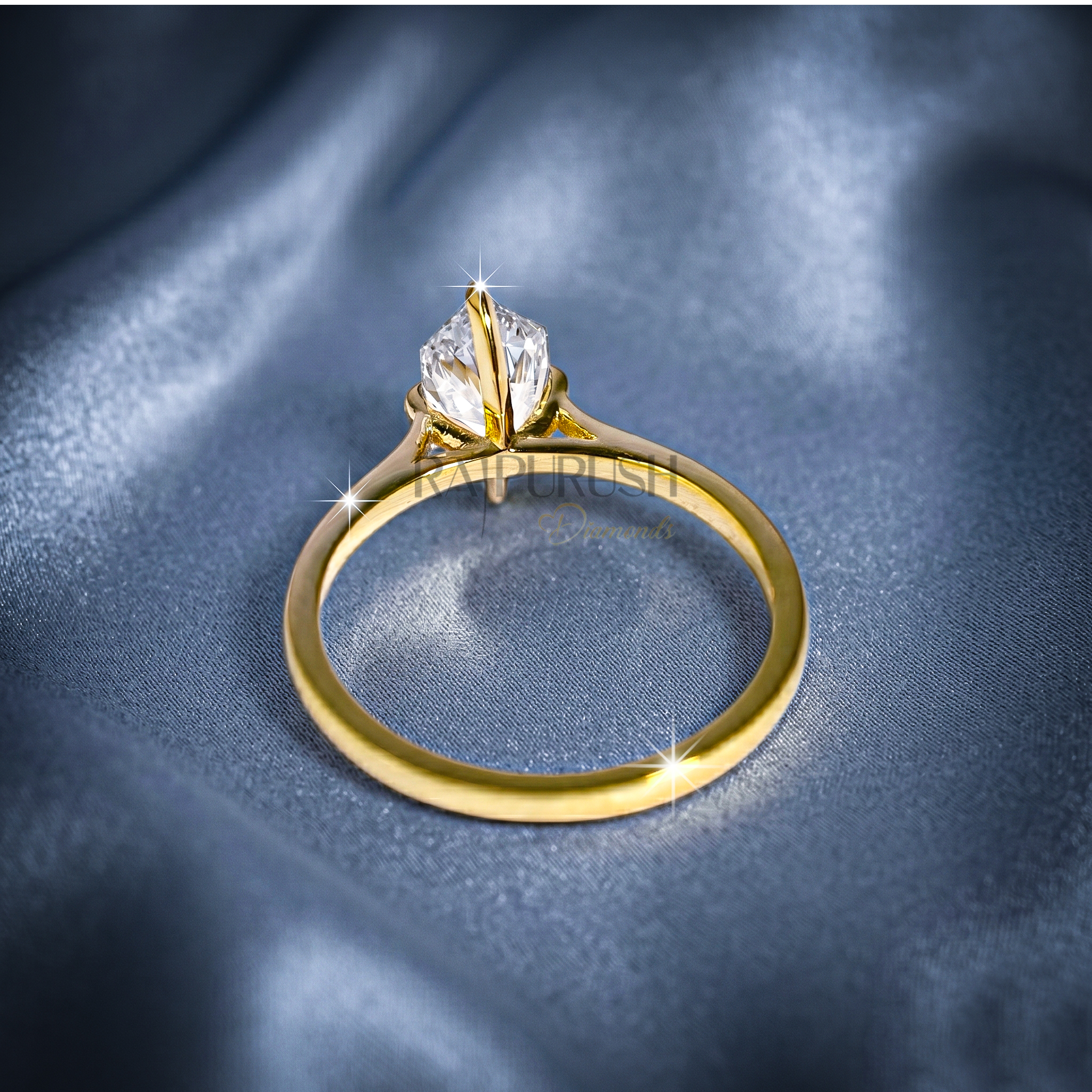 A striking Dutch Marquise cut moissanite engagement ring featuring a sleek solitaire setting in 14k gold-plated silver
