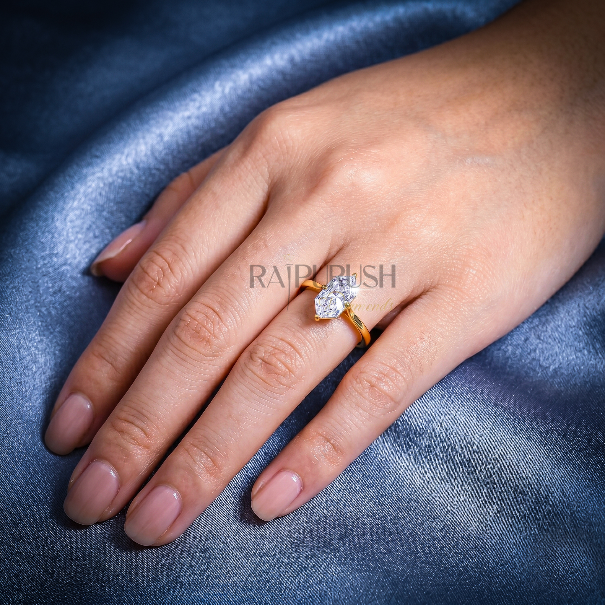 A striking Dutch Marquise cut moissanite engagement ring featuring a sleek solitaire setting in 14k gold-plated silver