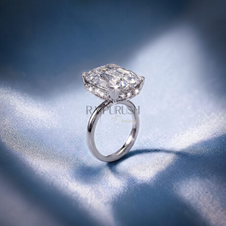 Elongated Cushion cut moissanite solitaire engagement ring in solid silver showcasing incredible crushed ice brilliance on blue silk.
