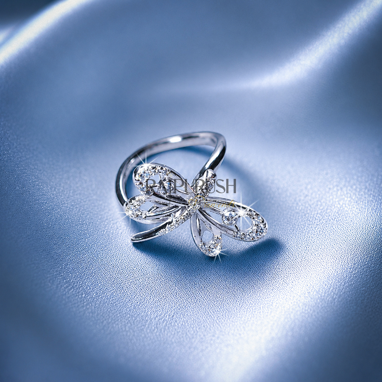 High-shine 925 sterling silver dragonfly ring featuring openwork filigree wings accent-set with brilliant round moissanite diamonds on a smooth comfort-fit band.