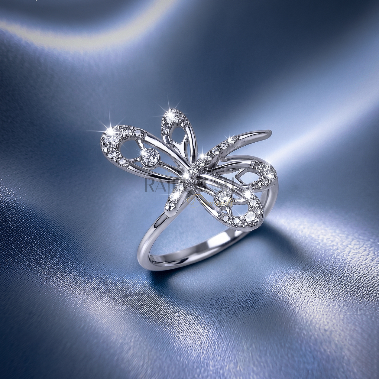 High-shine 925 sterling silver dragonfly ring featuring openwork filigree wings accent-set with brilliant round moissanite diamonds on a smooth comfort-fit band.