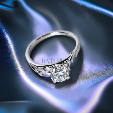 Unique nature-inspired engagement ring in S925 sterling silver featuring a textured twig branch band accented with marquise diamond leaves and a round moissanite center stone.