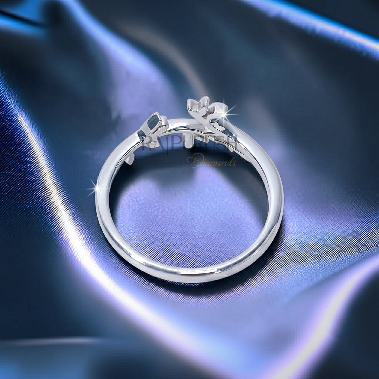 High-polish 925 sterling silver nature-inspired wedding band featuring a delicate bypassing leaf and vine branch motif in a stackable boho bridal style.