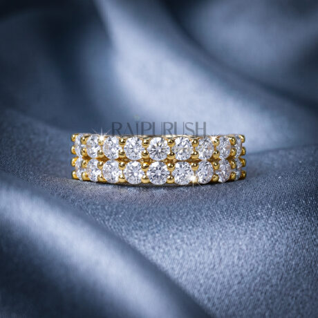 A double row round moissanite wedding band, set in 14k yellow gold plated sterling silver.