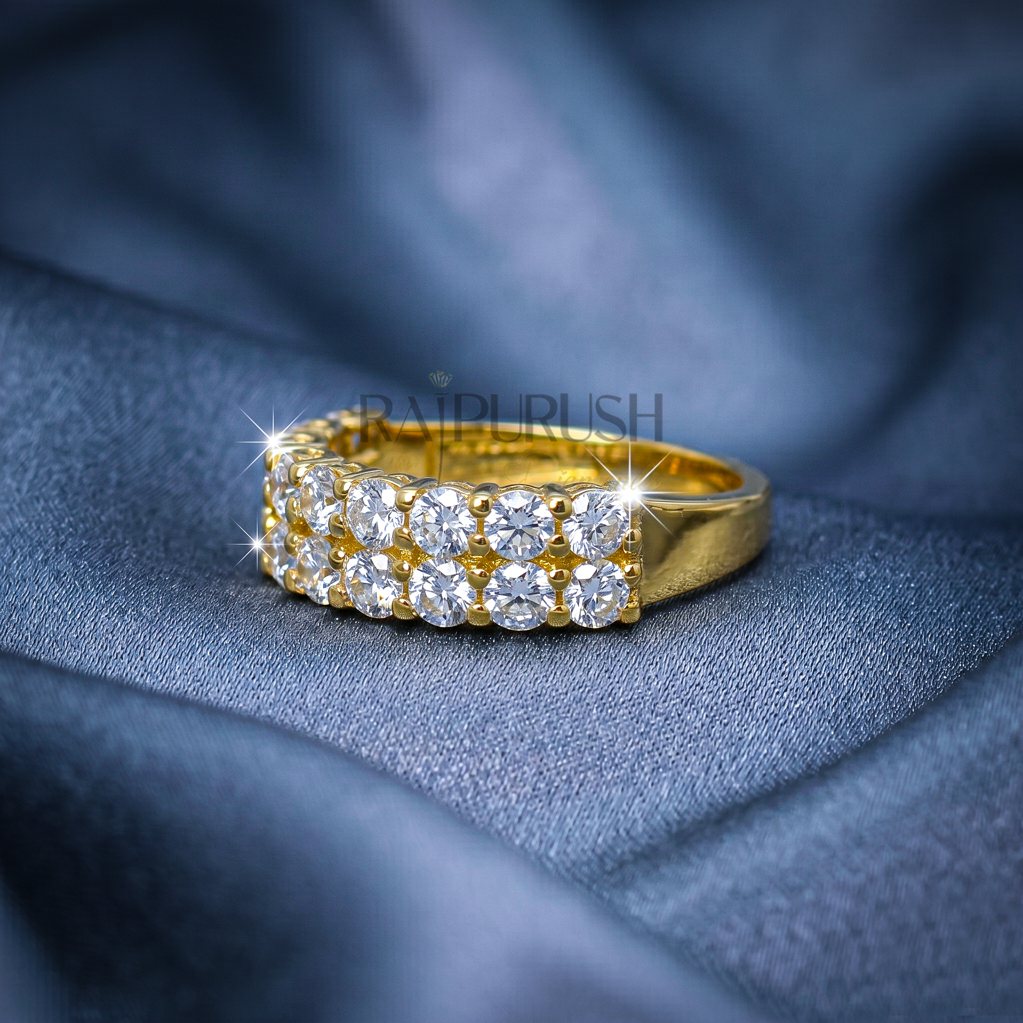 A double row round moissanite wedding band, set in 14k yellow gold plated sterling silver.